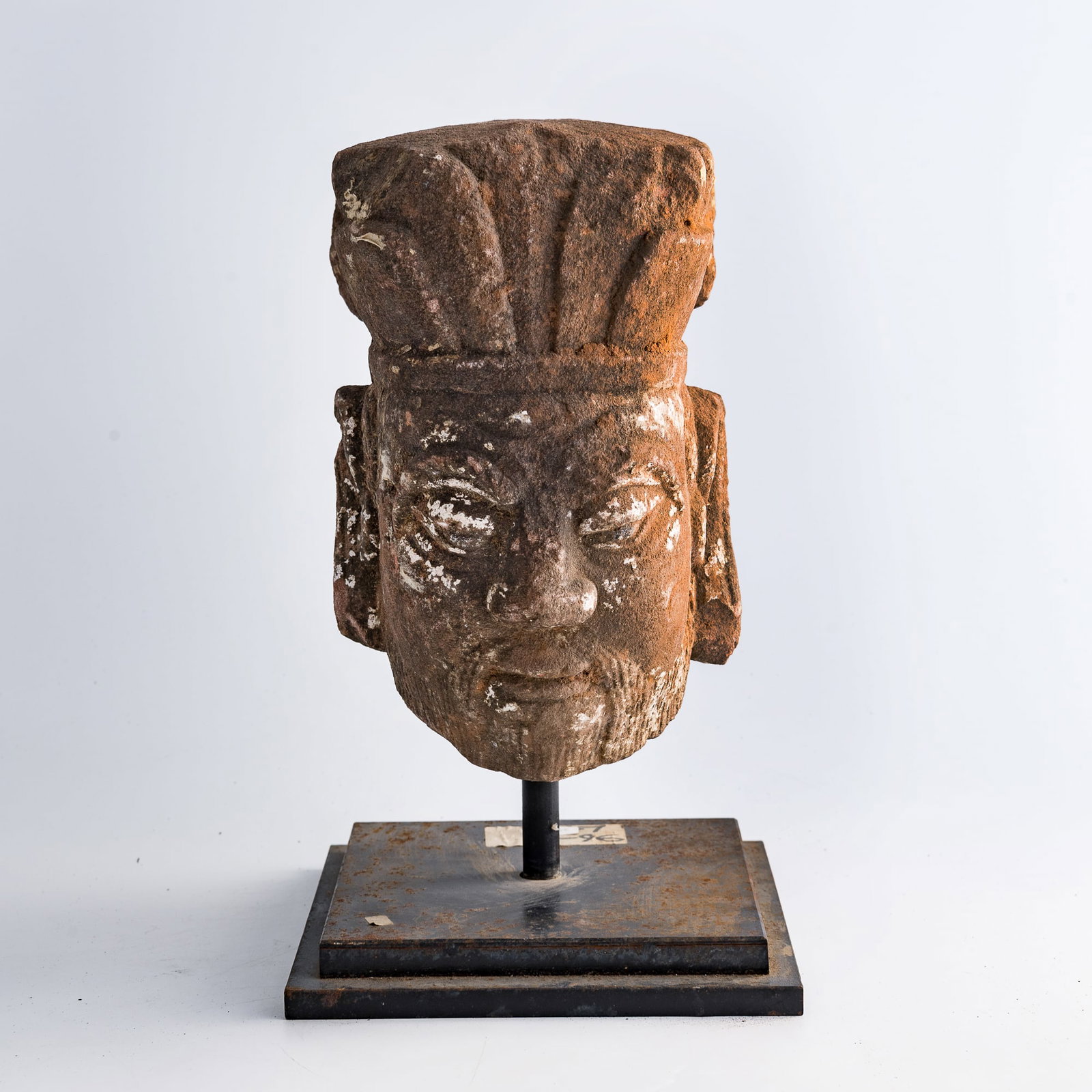 A Chinese stone head, Ming dynasty or earlier: A Chinese stone head Ming dynasty or earlier Appears to be the head of an official based on the headdress and facial style. Sold with a stand. H: 10 1/2, W: 6 1/2, D: 8 1/2 in. (H: 26.7, W: 16.5, D: 2