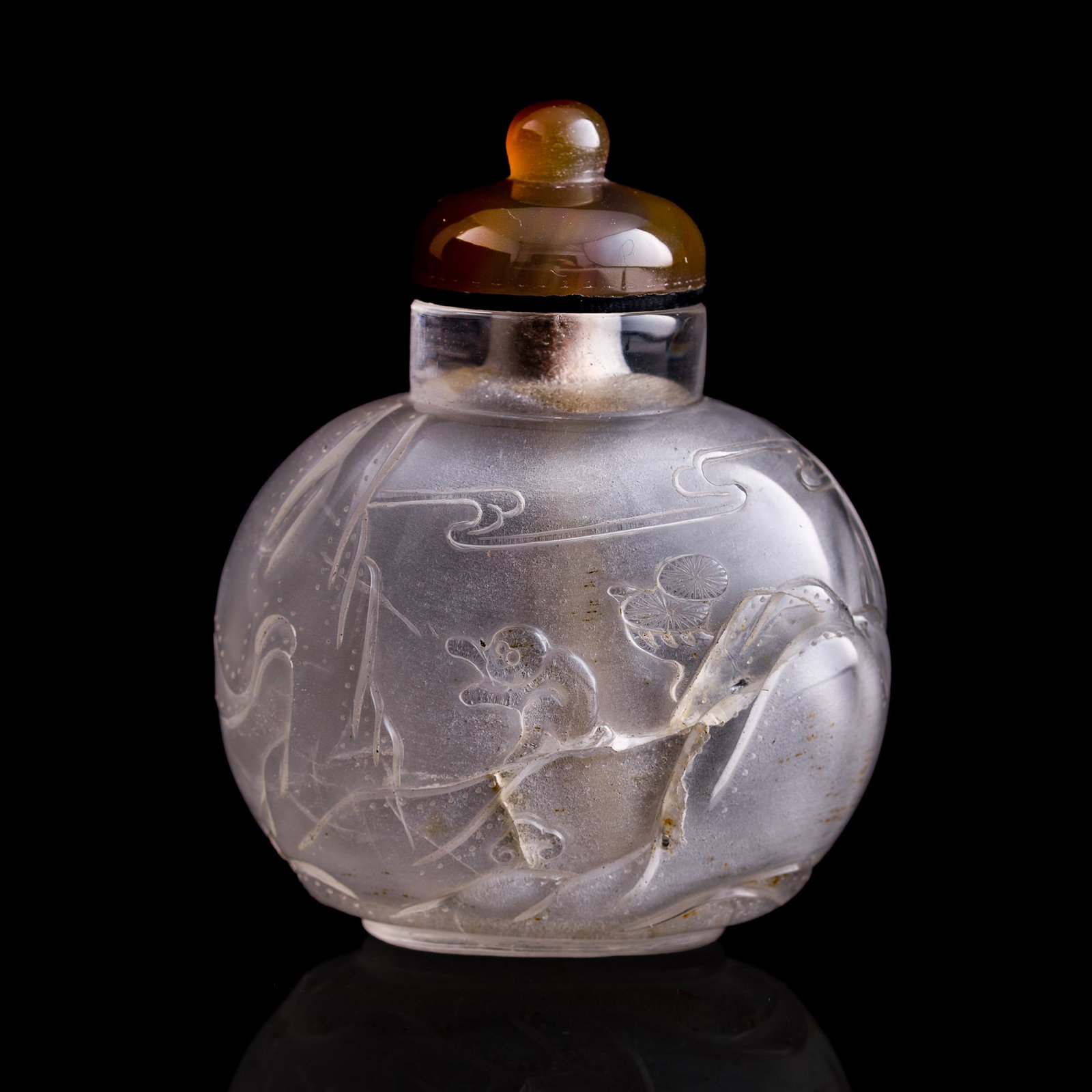 A Chinese crystal 'pine and monkey' snuff bottle, 19th century: A Chinese crystal 'pine and monkey' snuff bottle 19th century H: 3 1/4, W: 2 5/8, D: 1 5/8 in. (H: 8.3, W: 6.7, D: 4.1 cm.) Private collection, Florida. Click here