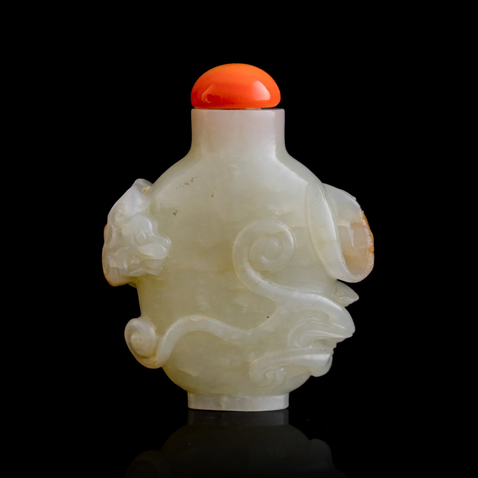 A Chinese white jade 'chilong' snuff bottle with russet skin, 18th century: A Chinese white jade 'chilong' snuff bottle with russet skin 18th century H: 2 1/4, W: 1 3/4, D: 3/4 in. (H: 5.7, W: 4.4, D: 1.9 cm.) Private collection, Florida.