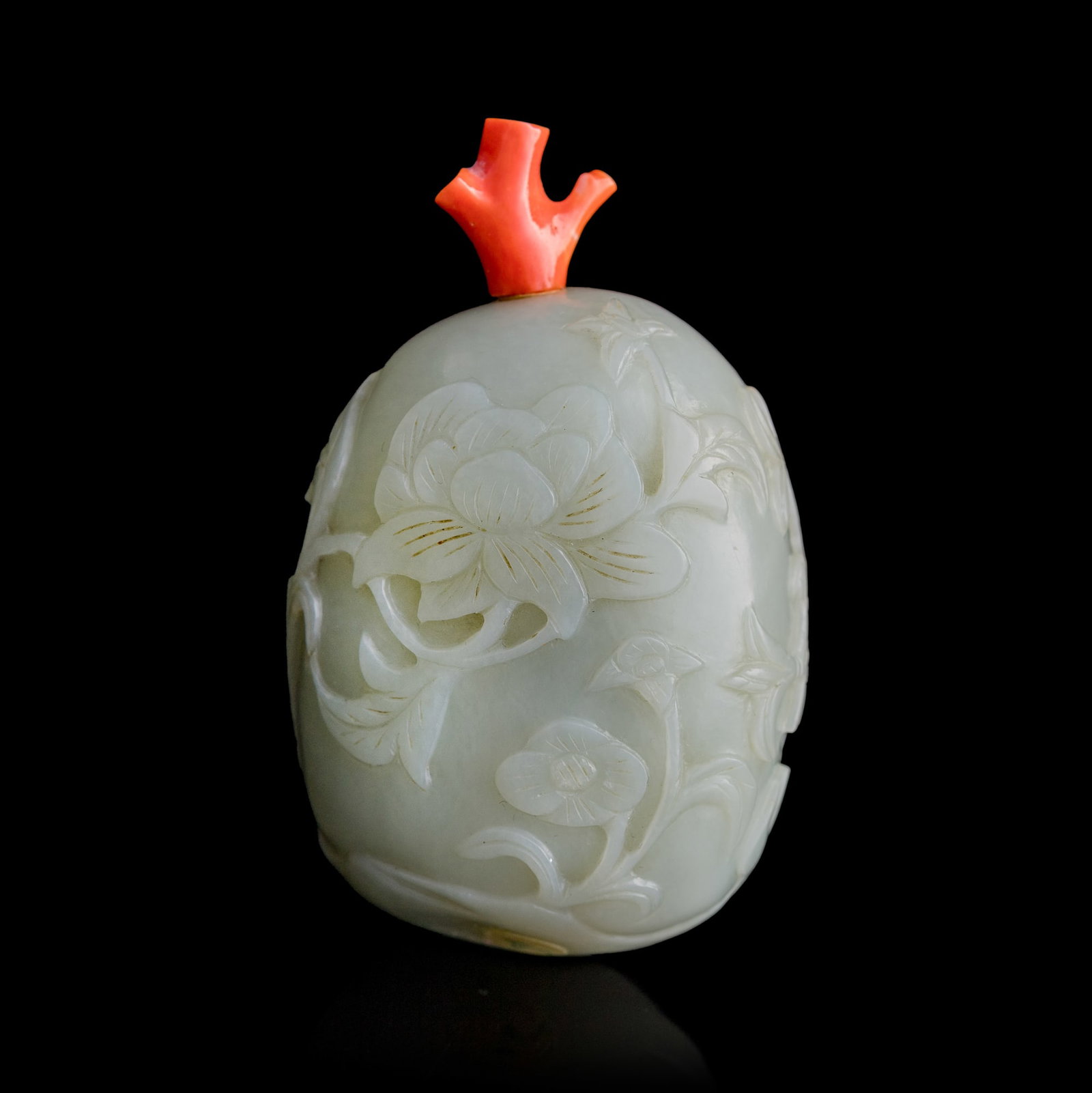 A Chinese white jade melon-form floral snuff bottle, Qing dynasty: A Chinese white jade melon-form floral snuff bottle Qing dynasty Relief includes carved figure of a phoenix covered with russet skin H: 3 1/4, W: 2, D: 1 1/2 in. (H: 8.3, W: 5.1, D: 3.8 cm.) Private c