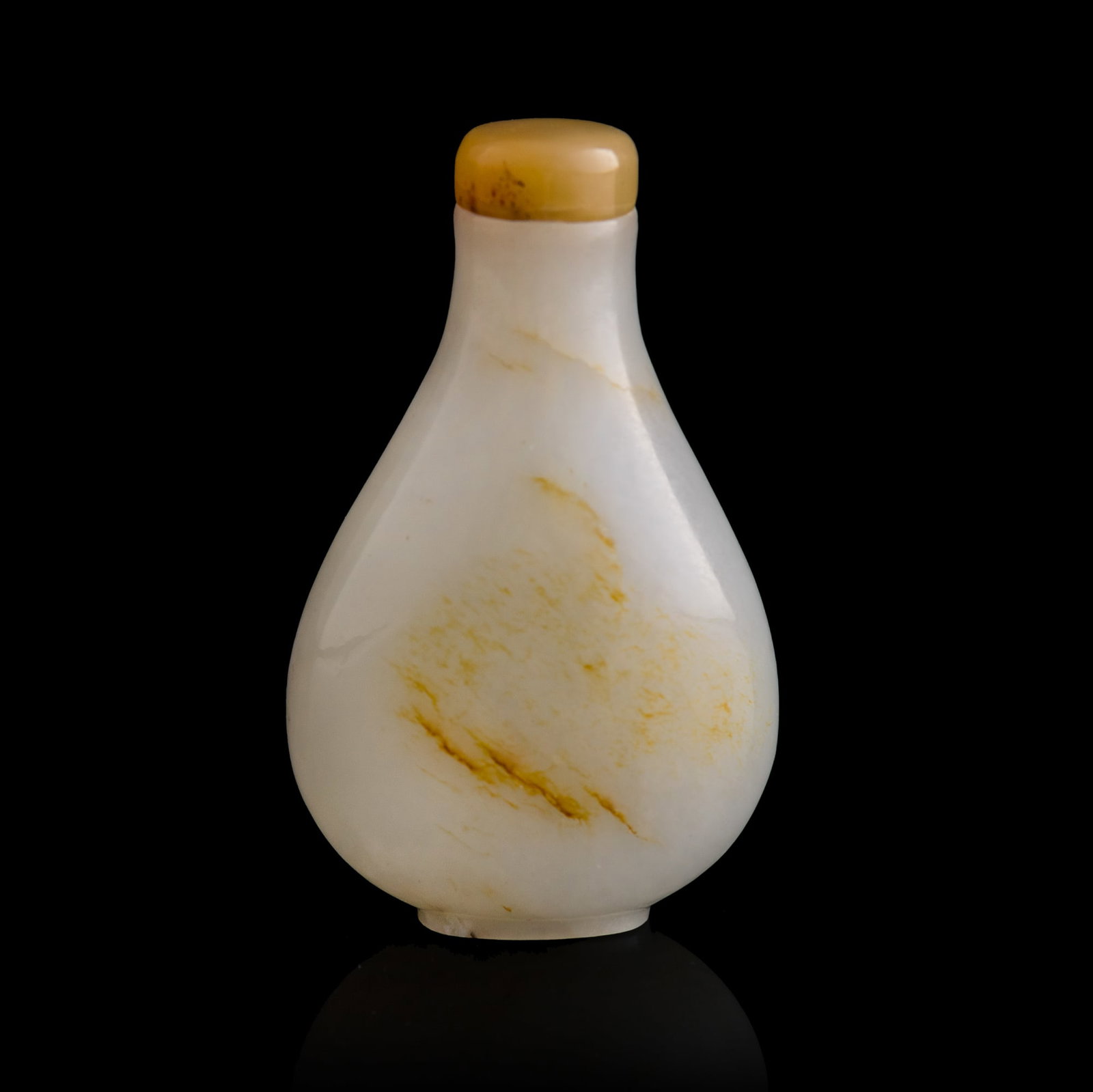 A Chinese white jade russet-skin snuff bottle, early 19th century: A Chinese white jade russet-skin snuff bottle early 19th century H: 2 7/8, W: 1 3/4, D: 1 in. (H: 7.3, W: 4.4, D: 2.5 cm.) From Mr. Yip of Seattle, Washington. Cli