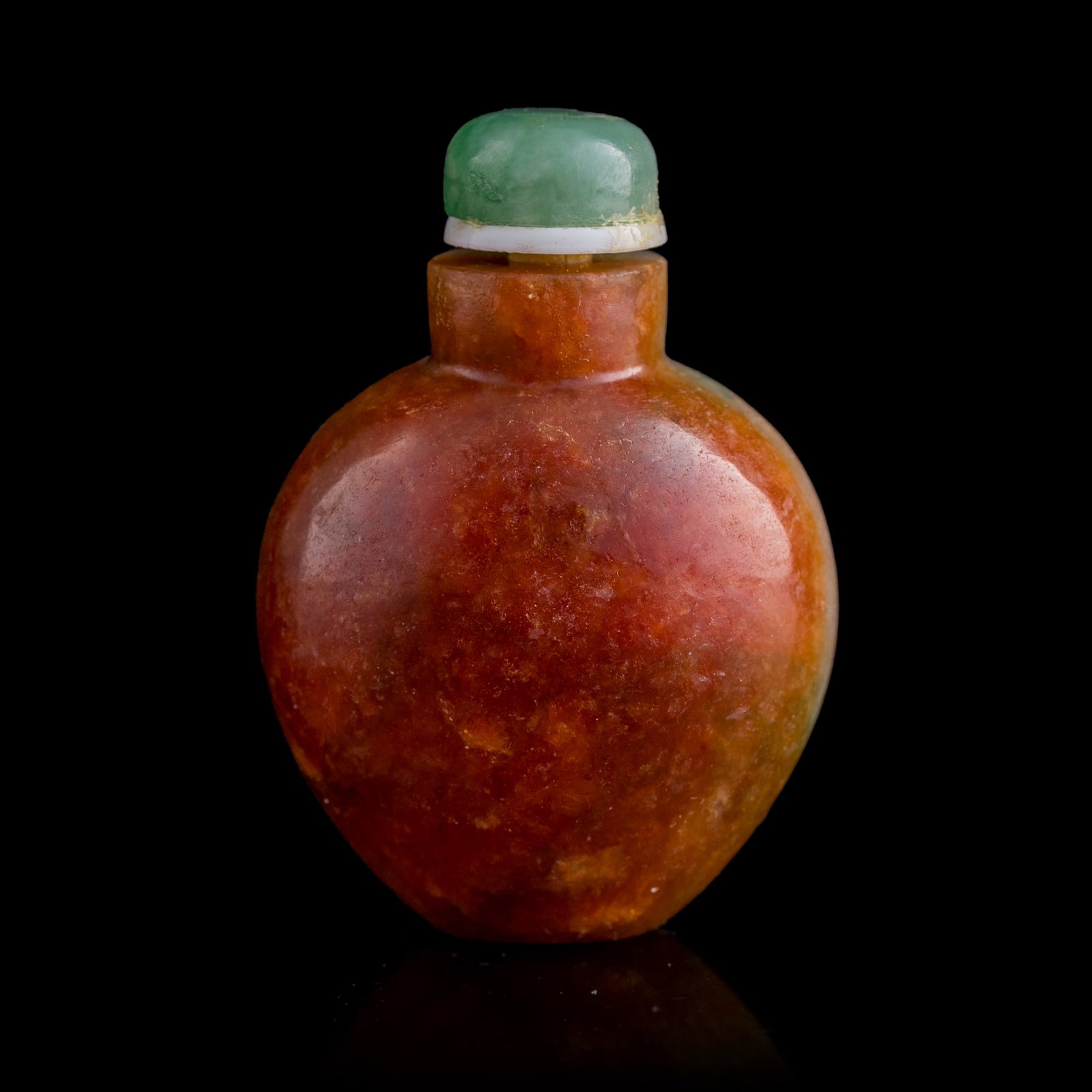 A Chinese two-color jadeite snuff bottle, Qing dynasty: A Chinese two-color jadeite snuff bottle Qing dynasty H: 2 1/4, W: 1 5/8, D: 1 in. (H: 5.7, W: 4.1, D: 2.5 cm.) Private collection, New Jersey. Click here for high