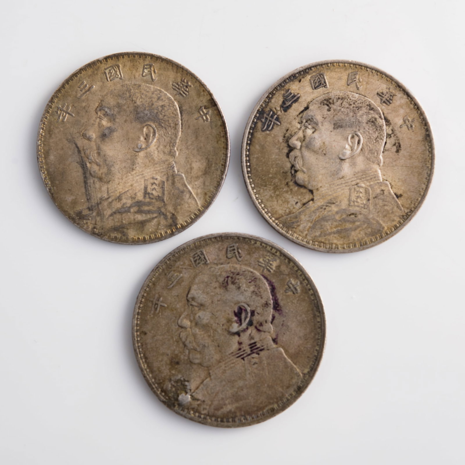 Three Chinese 'Yuan Shikai' portrait silver dollars, 1914: Three Chinese 'Yuan Shikai' portrait silver dollars 1914 Diameter range: 38.6-39 mm; depth range: 2.2-2.3 mm Weight range: 26.73-26.84 g Lots 1-15 are from the estate of a woman in Silver Spring, Mary