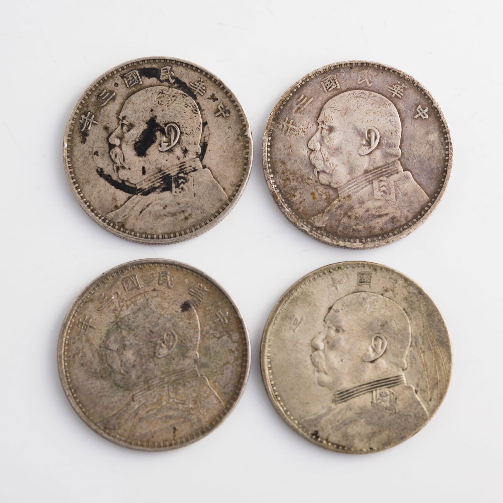 Four Chinese 'Yuan Shikai' portrait silver dollars, 1914 and 1921: Four Chinese 'Yuan Shikai' portrait silver dollars 1914 and 1921 Diameter range: 38.8-39 mm; depth range: 2.2-2.3 mm Weight range: 26.33-26.88 g Lots 1-15 are from the estate of a woman in Silver Spri