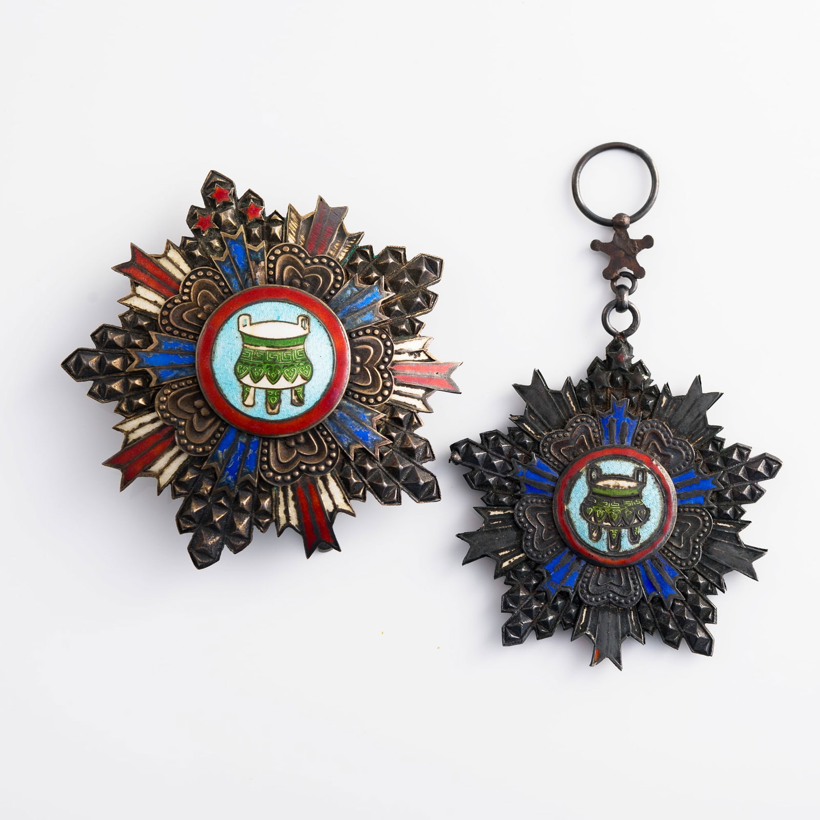 A Chinese First Class Order of the Precious Tripod breast star and badge, Republic period: A Chinese First Class Order of the Precious Tripod breast star and badge Republic period H: 3 1/4, W: 3, D: 3/4 in. (H: 8.3, W: 7.6, D: 1.9 cm. (largest)) Weight: 113.5 g (overall) Lots 1-15 are from 