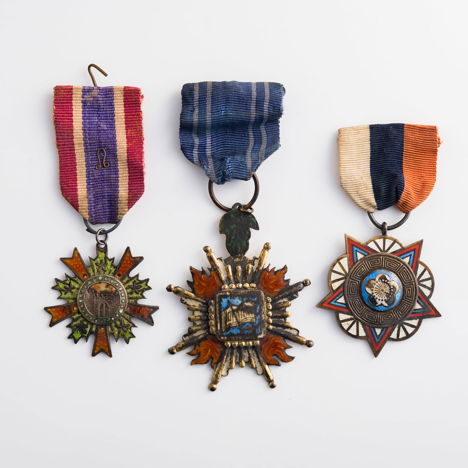 A Chinese Class B First Grade army, navy and air force medal and two other medals, Republic period: A Chinese Class B First Grade army, navy and air force medal and two other medals Republic period Medal: H: 2 1/2, W: 2, D: 1/8 in. (H: 6.4, W: 5.1, D: 0.3 cm (largest)) Weight: 68.14 g (overall) Lots