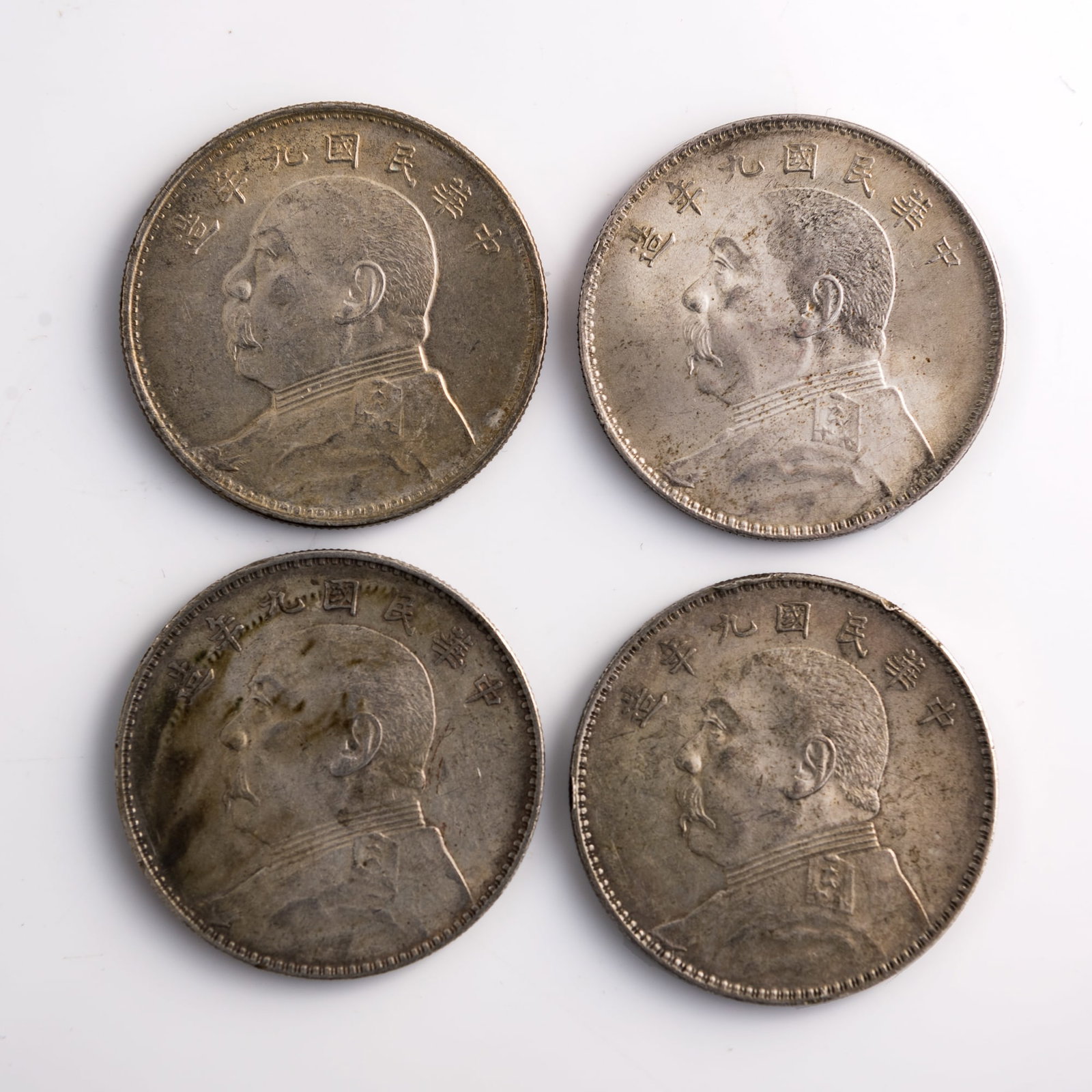 Four Chinese 'Yuan Shikai' silver dollars, 1920: Four Chinese 'Yuan Shikai' silver dollars 1920 Diameter range: 38.8-39 mm; Depth range: 2.3-2.4 mm. Weight range: 26.55-26.89 g From Mr. Hsu in Chicago, Illinois; a family inheritance.