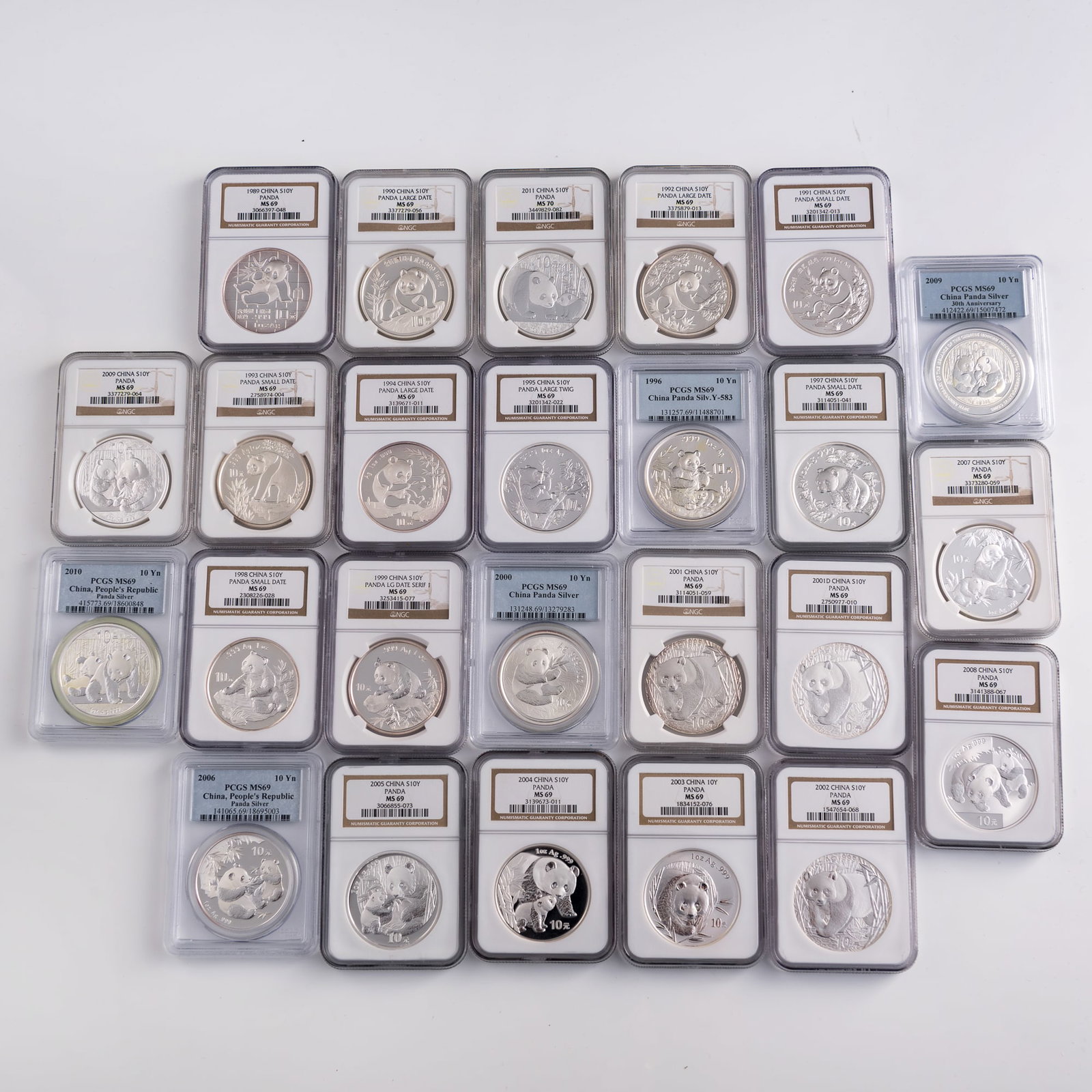Twenty-five graded Chinese silver panda coins, 1989-2011: Twenty-five graded Chinese silver panda coins 1989-2011 Each graded by either Numismatic Guaranty Corporation or PCGS. Sold with a collector's case. (25). Coin Dia: 40 mm (each) Case: H: 4 1/8, W: 15,