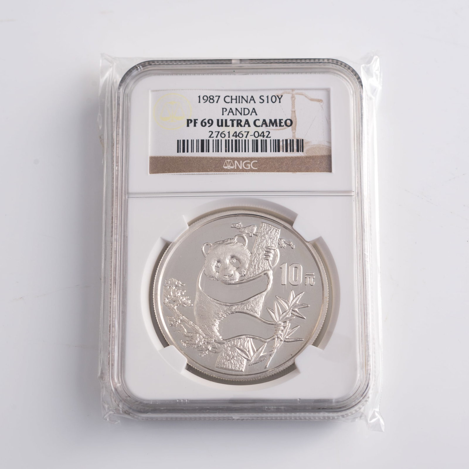A graded Chinese silver panda coin, 1987 (1 of 5)