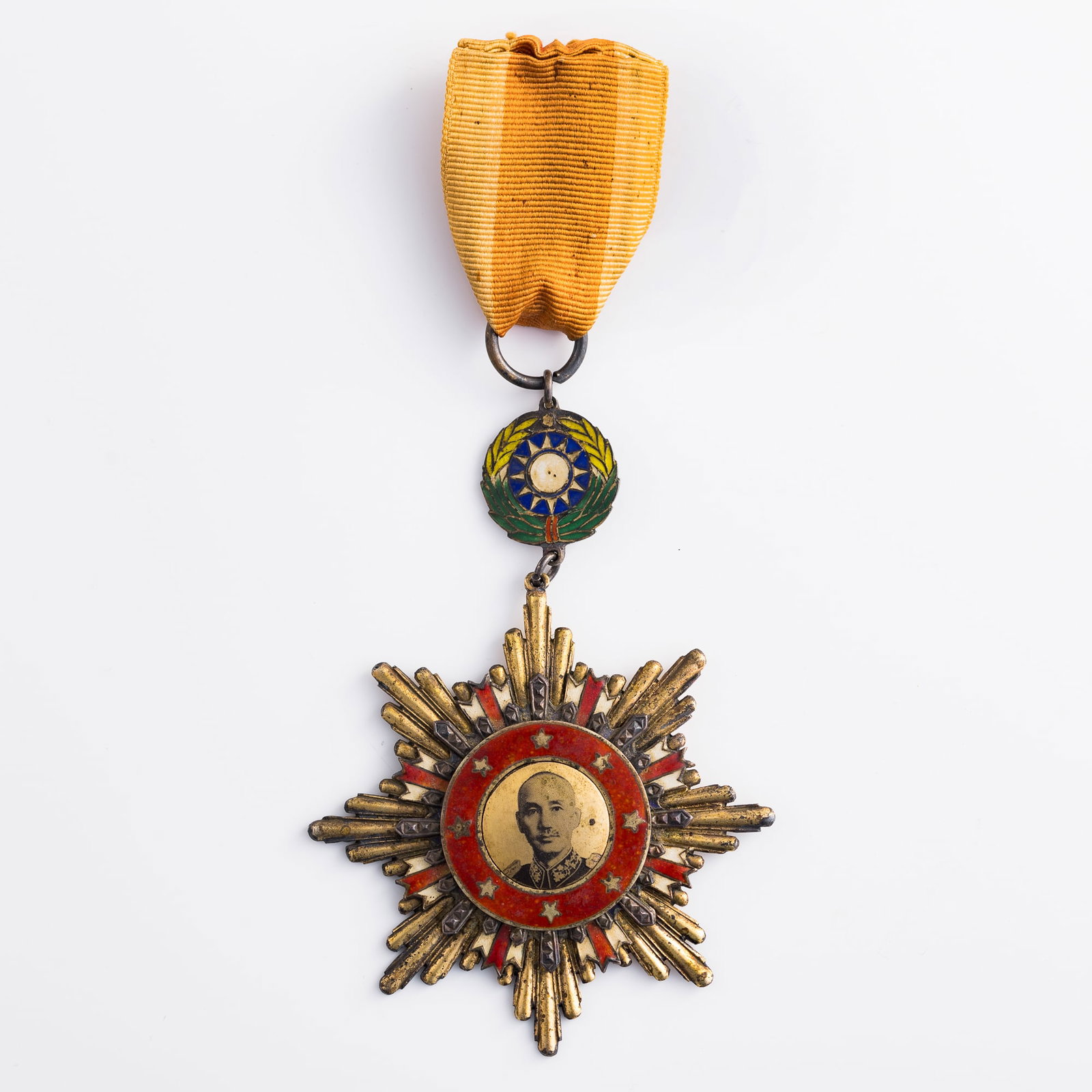 A Chinese victory medal of resistance against aggression, 1945: A Chinese victory medal of resistance against aggression 1945 Medal: H: 2 7/8, W: 2 7/8, D: 1/8 in. (H: 7.3, W: 7.3, D: 0.3 cm.) Overall height: 5 5/8 in. (14.3 cm.) Weight: 78.7 g Private collector, 