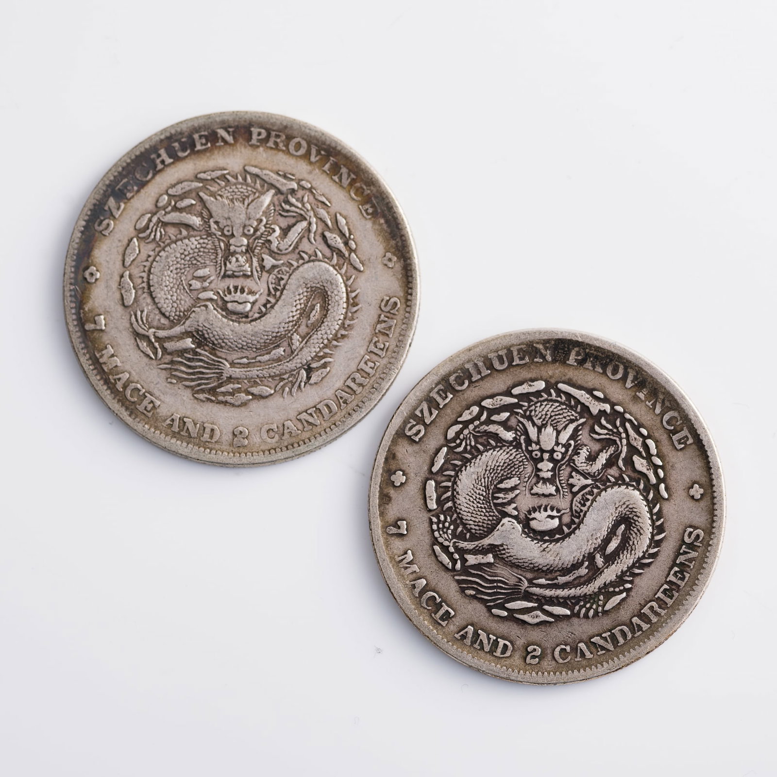 Two Guangxu Yuanbao Kuping 7 mace 2 candareen silver dollars, Sichuan Province Mint, Qing dynasty: Two Guangxu Yuanbao Kuping 7 mace 2 candareen silver dollars, Sichuan Province Mint Qing dynasty Diameter: 39.5 mm and 39.6 mm, depth: 2.2 mm each Weight: 26.43 g and 26.44 g From Mr. Shang of Wake Fo