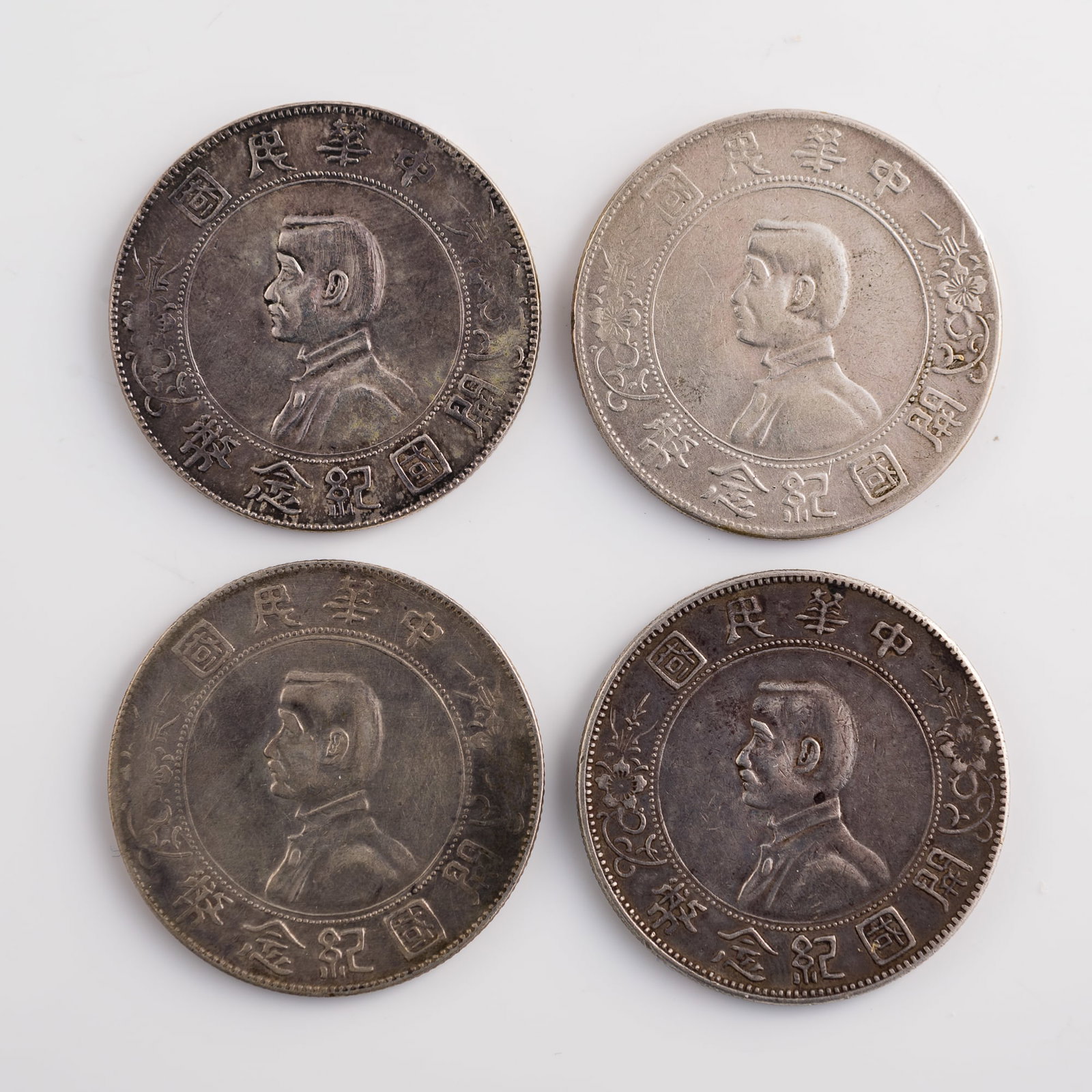Four Chinese Sun Yat-sen 'Founding of the Republic' commemorative silver dollars, Republic period: Four Chinese Sun Yat-sen 'Founding of the Republic' commemorative silver dollars Republic period Diameter range: 38.7-38.9 mm; depth: 2.2 mm (each) Weight range: 26.56-26.81 g From Mr. Shang of Wake F