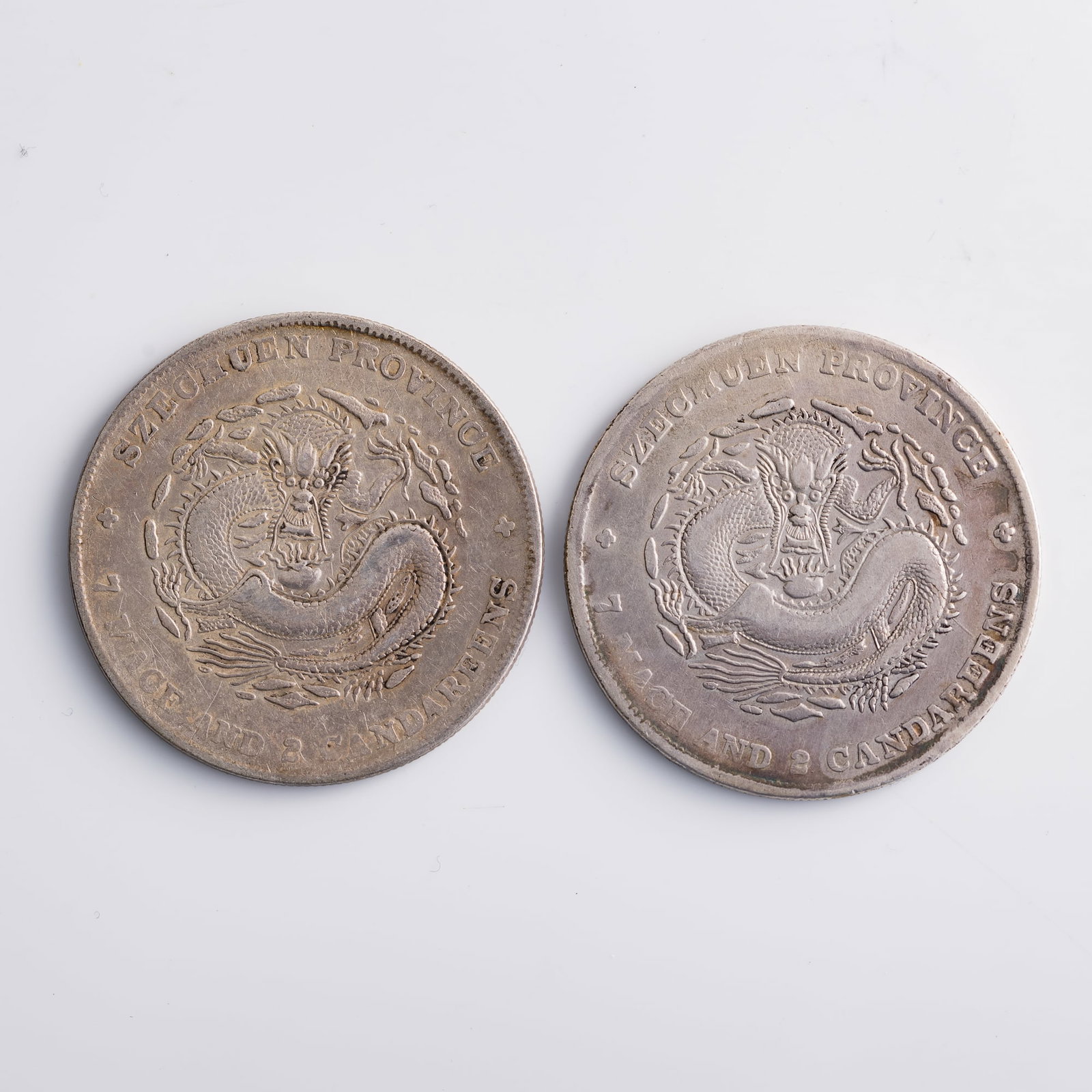 Two Xuantong Yuanbao Kuping 7 mace 2 candareen silver dollars, Sichuan Province Mint, Qing dynasty: Two Xuantong Yuanbao Kuping 7 mace 2 candareen silver dollars, Sichuan Province Mint Qing dynasty Diameter: 39.6 mm and 39.5 mm; depth: 2.2 mm each Weight: 26.61 g and 26.68 g From Mr. Shang of Wake F