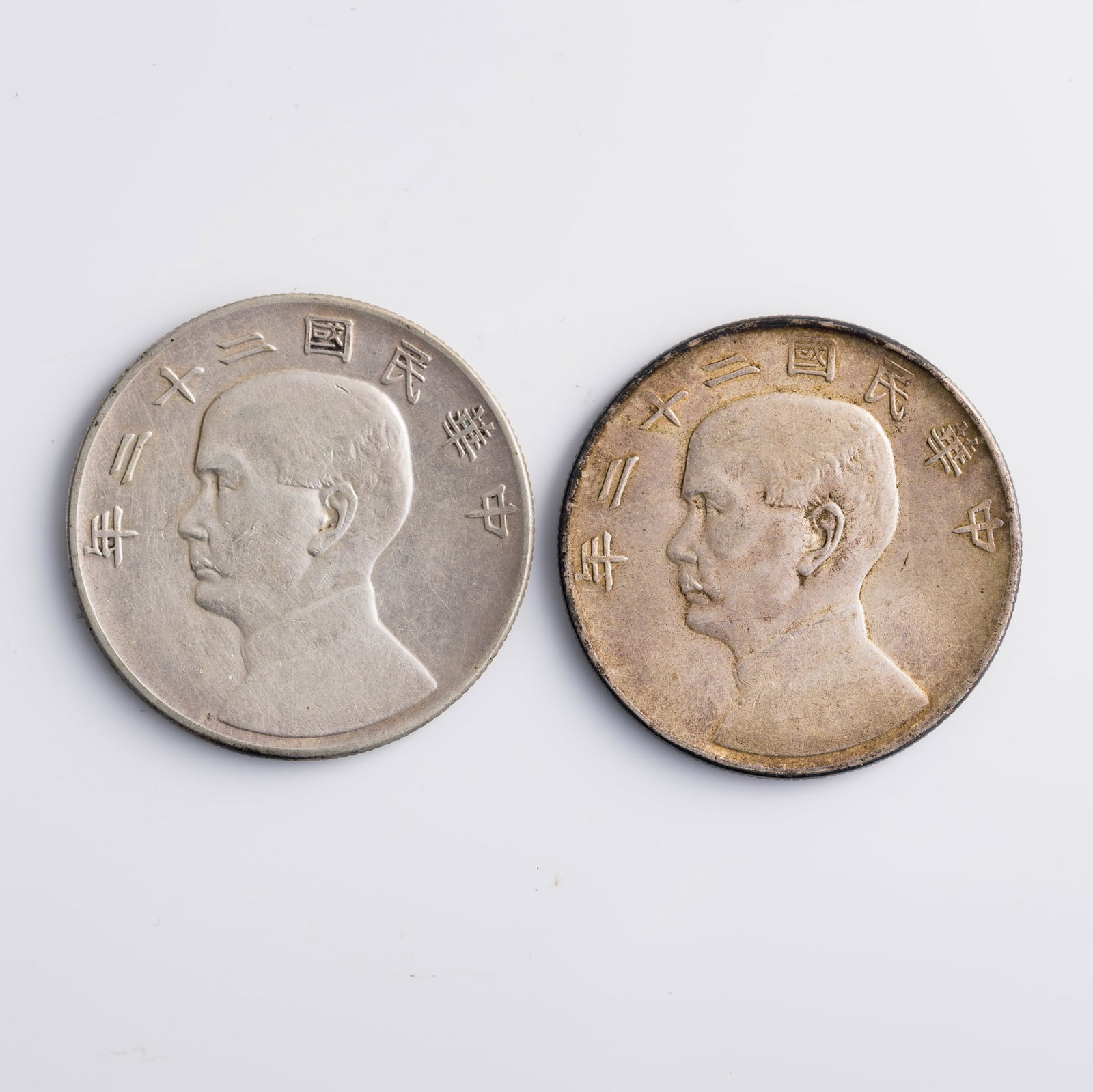 Two Chinese Sun Yat-sen 'Junk' silver dollars, 1933: Two Chinese Sun Yat-sen 'Junk' silver dollars 1933 Diameter: 39.3 mm and 39.4 mm; depth: 2.3 mm and 2.2 mm Weight: 26.67 g (both) From Mr. Shang of Wake Forrest, North Carolina; inherited from his fat