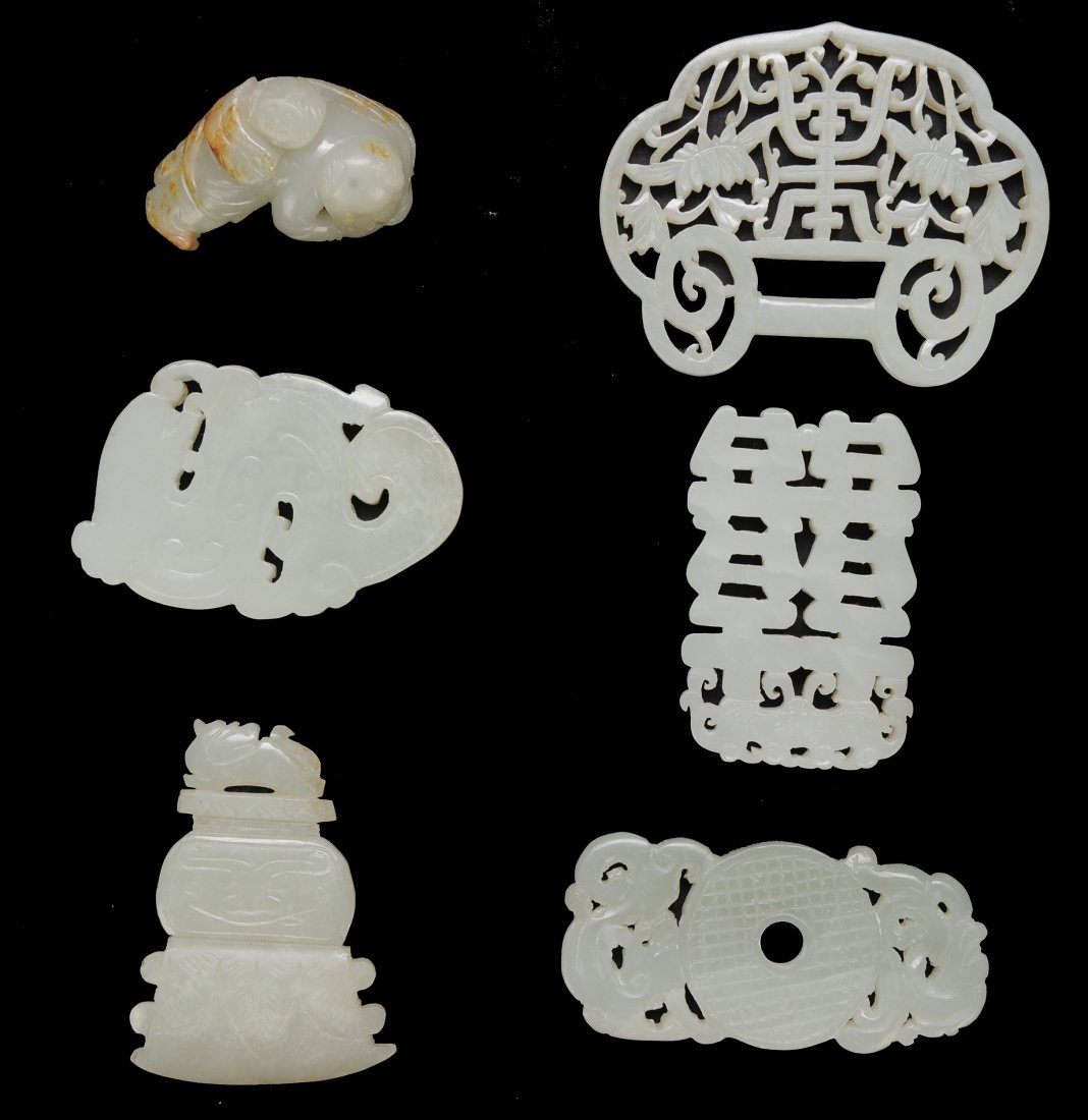 Six Jade Plaques and Toggles, 18th/19th Century: A Group of Six Chinese Jade Plaques and Toggles, 18th/19th Century The first item is a carved and pierced celadon jade dragon shaped plaque. The second item is a carved and pierced celadon jade axe sh