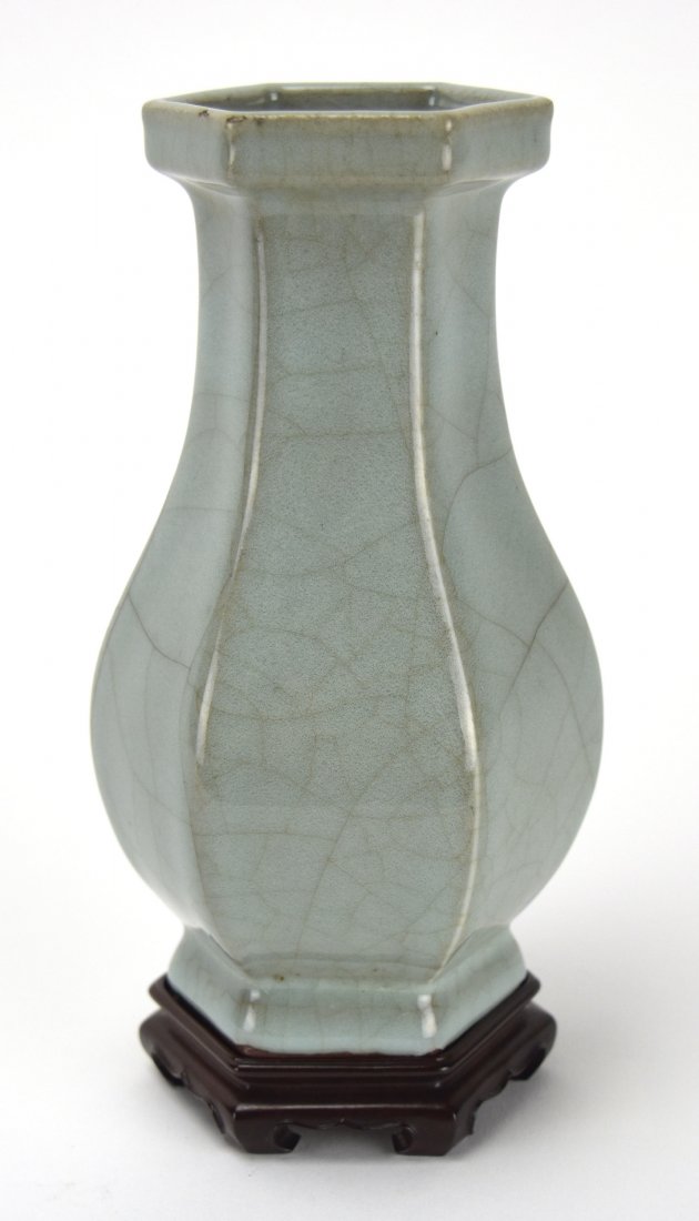 Guan Glazed Hexagonal Vase, Early 20th Century: A Chinese Guan Glazed Hexagonal Vase, Early 20th Century This blue gray colored hexagonal vase, features a galleried rim and splayed foot. It sits upon a wooden base, and is approximately 6 3/8 inches
