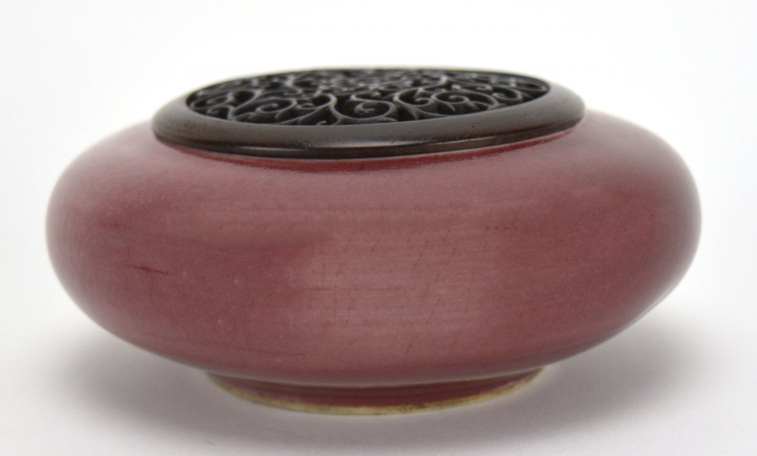 Peach Bloom Covered Brush Washer, Late19th Century: A Chinese Peach Bloom Covered Brush Washer, Late 19th Century This peach bloom brush washer features a rosewood openwork cover. It is approximately 1 7/8 inches high X 4 7/8 inches in diameter. Condit
