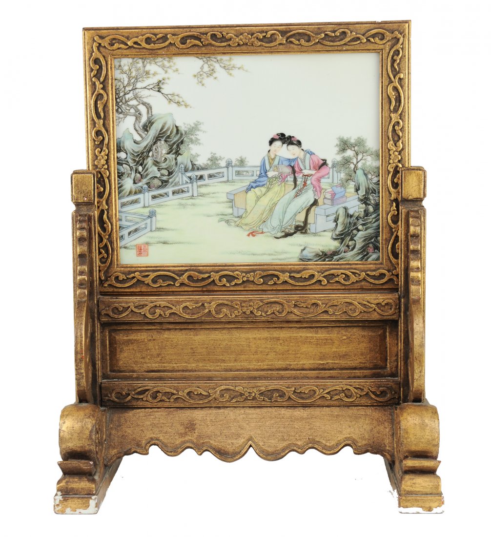 Table Screen with a Famille Rose Porcelain Plaque: A Chinese Table Screen with a Famille Rose Porcelain Plaque, Republic Period (1912-1949) This table screen consists of a famille rose porcelain plaque depicting two women, sitting with their heads tog