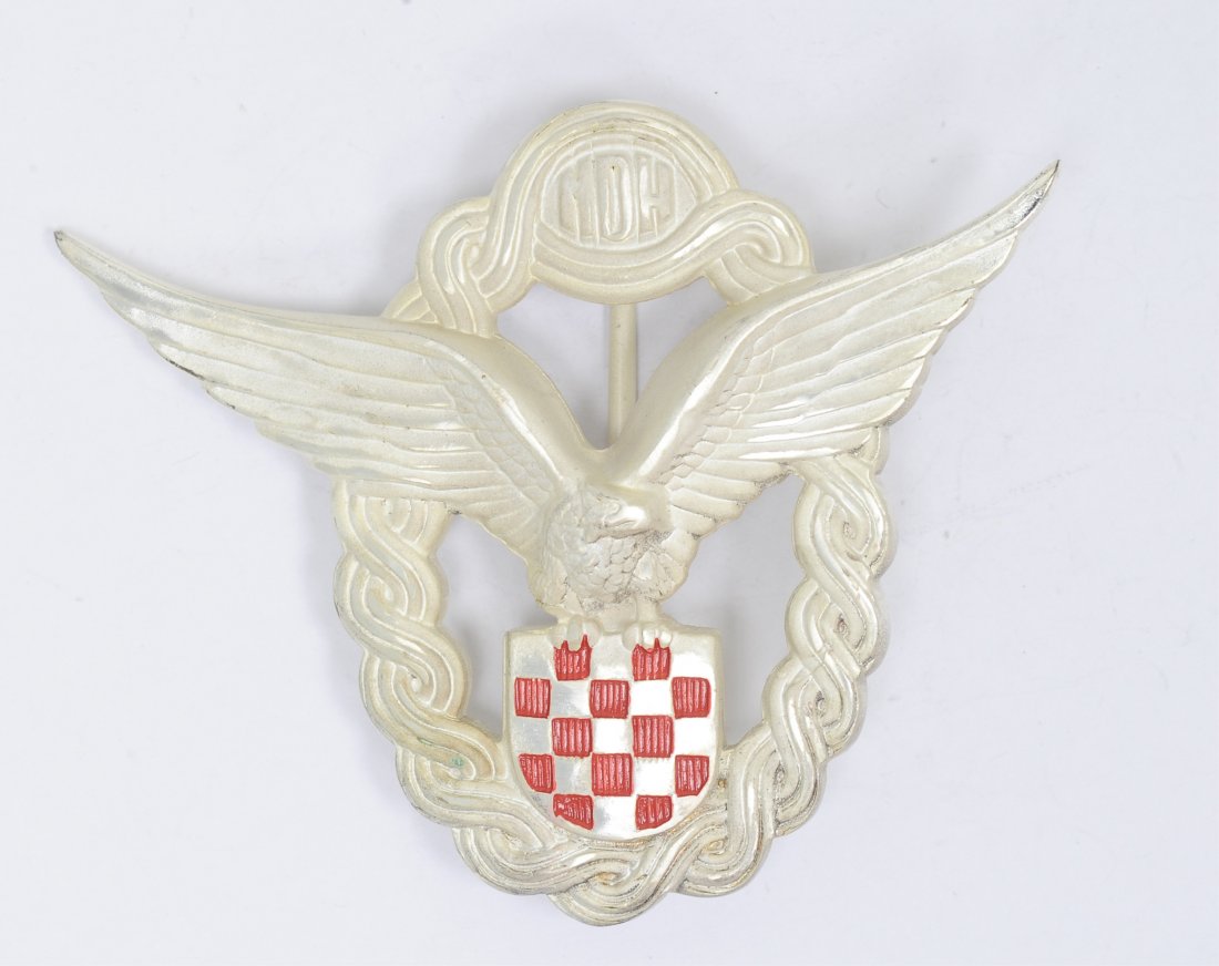 German Croatians WWII Luftwaffe Axis Pilot Badge: German Croatians WWII Luftwaffe Axis Pilot Badge. Has a wide vertical pin back. Nickel construction. Condition: Excellent condition. Note: Some items in this sale may contain symbols that are consider