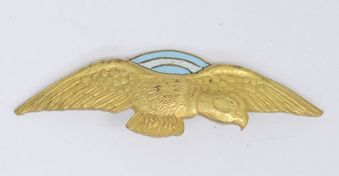 Italian German WWII Axis Pilot Wing: Italian German WWII Axis Pilot Wing. Has a thin horizontal pin back. Brass construction with enamel. Condition: Excellent condition. Note: Some items in this sale may contain symbols that are consider