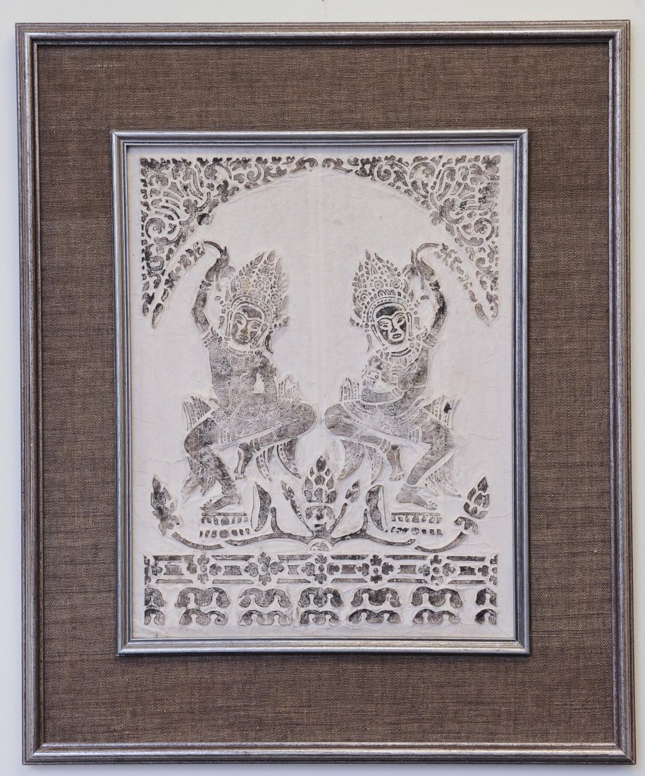 Temple Rubbing on Thai Cotton Matting: Thai or Cambodian Temple Rubbing on Thai Cotton Matting. This embossed rubbing is in a silver painted wood and cloth frame. It is approximately 16 3/4 inches high X 13 1/4 inches wide. Condition: It i