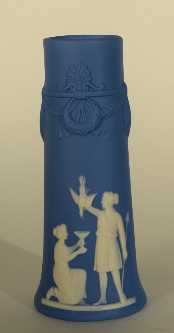 Jasper Ware Blue Vase: Jasper Ware Blue Vase. This vase has white bas relief carved women near the base and is marked on the bottom with 3125, Germany. Vase stands approximately 4 3/4 inches high.