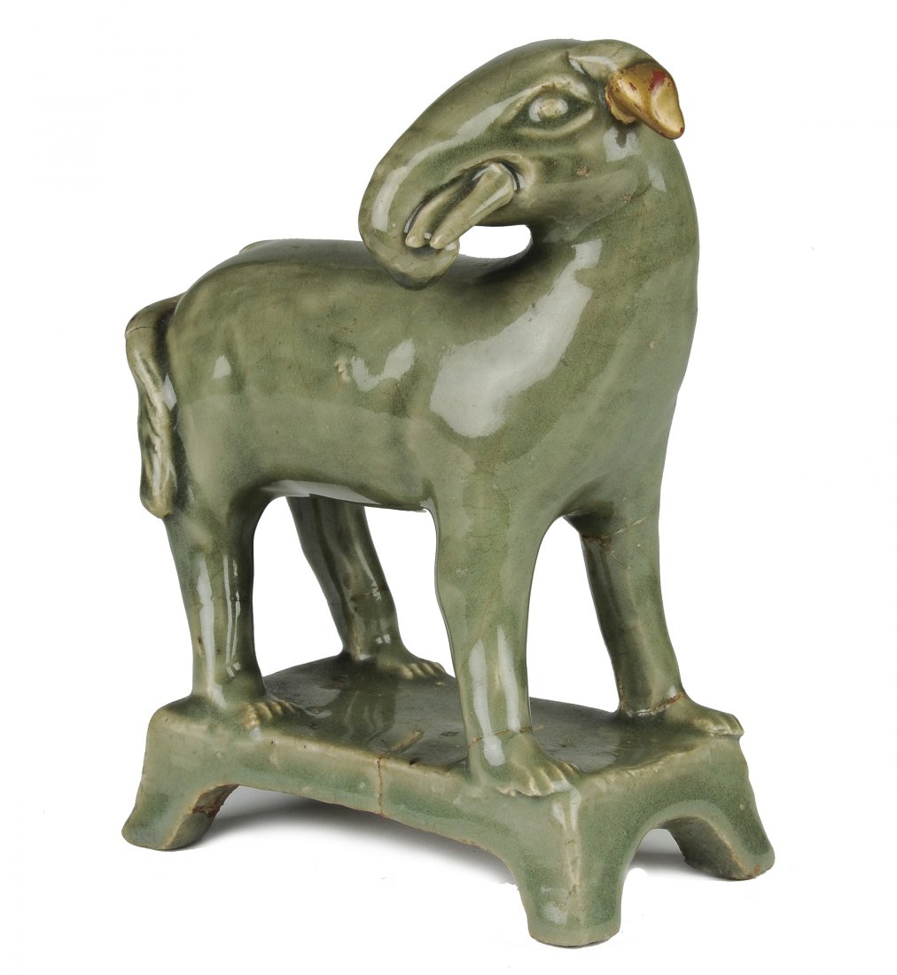 Longquan Celadon Mythical Creature: Green Longquan Celadon Mythical Creature, Yuan - Ming Dynasty. This green Longquan celadon figurine is of a mythical chimera with an elephant's trunk and tusks, a tiger's feet, and an ox-like tail. On