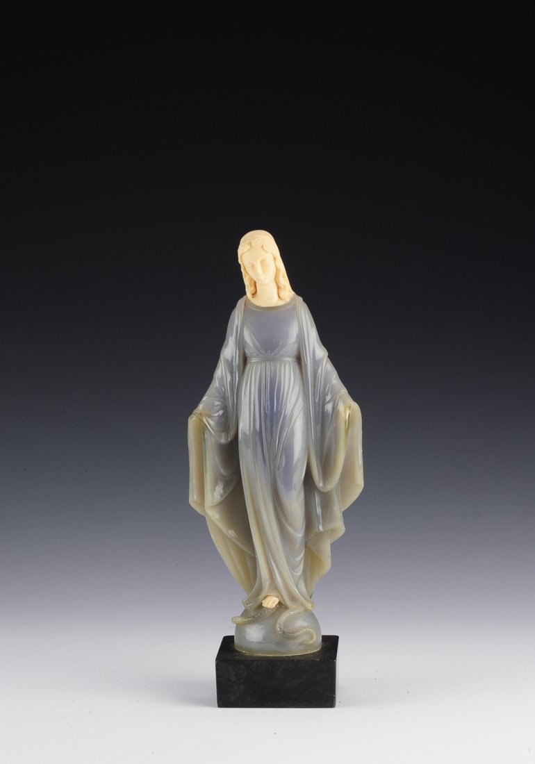 Alabaster Mary Statue by G. Ruggeri: This alabaster statue is of Mary standing on a snake and orb. Set in a stone base, the statue is marked "G. Ruggeri" and "©B". The base is marked on the back with "© Bianchi". Gino Ruggeri is a well