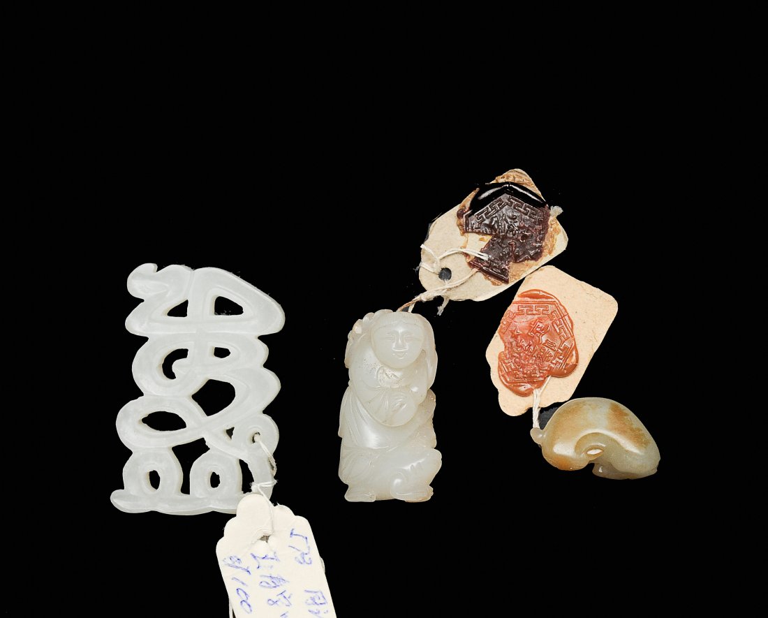 Trio of White Jade Carvings, 18th - 19th Century: Trio of white jade carvings from the 18th - 19th Century. Includes carving of Shou character, small carving of a boy, and a small carving of a cat. Dimensions range from 7/8 inch wide by 3/8 inch high