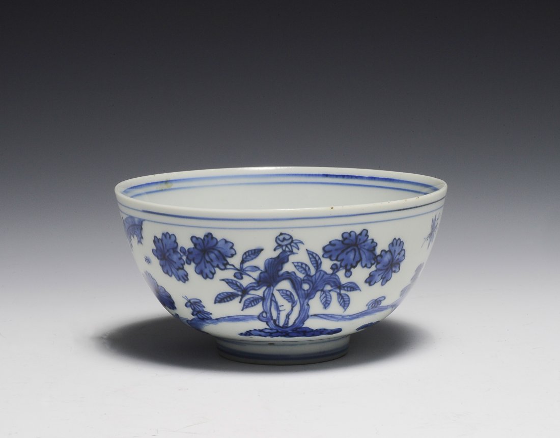 Blue & White Bowl, Late Ming Dynasty: Blue and white bowl from the late Ming Dynasty. Bowl has a flower in blue underglaze in the center of the interior. Exterior is a landscape filled with trees and flowers. Bottom has a character mark i