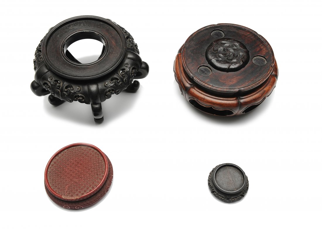Four Bases, Qing Dynasty: 1. Hardwood base from the 19th Century. Base has five feet and is well carved. Dimensions are 7 1/2 inches in diameter by 4 1/2 inches high. 2. Huanghuali base from the Qing Dynasty. This base was des