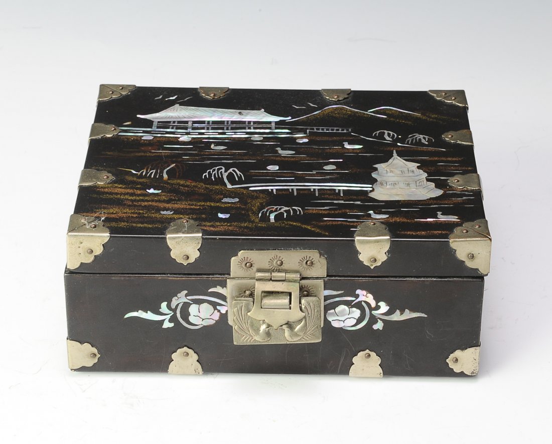 Mother of Pearl Jewelry Box: Mother of Pearl inlaid wooden jewelry box with lock and interior mirror. The dimensions are 7 inches wide by 6 inches high. All measurements are approximate. Condition: The box is locked with the latc