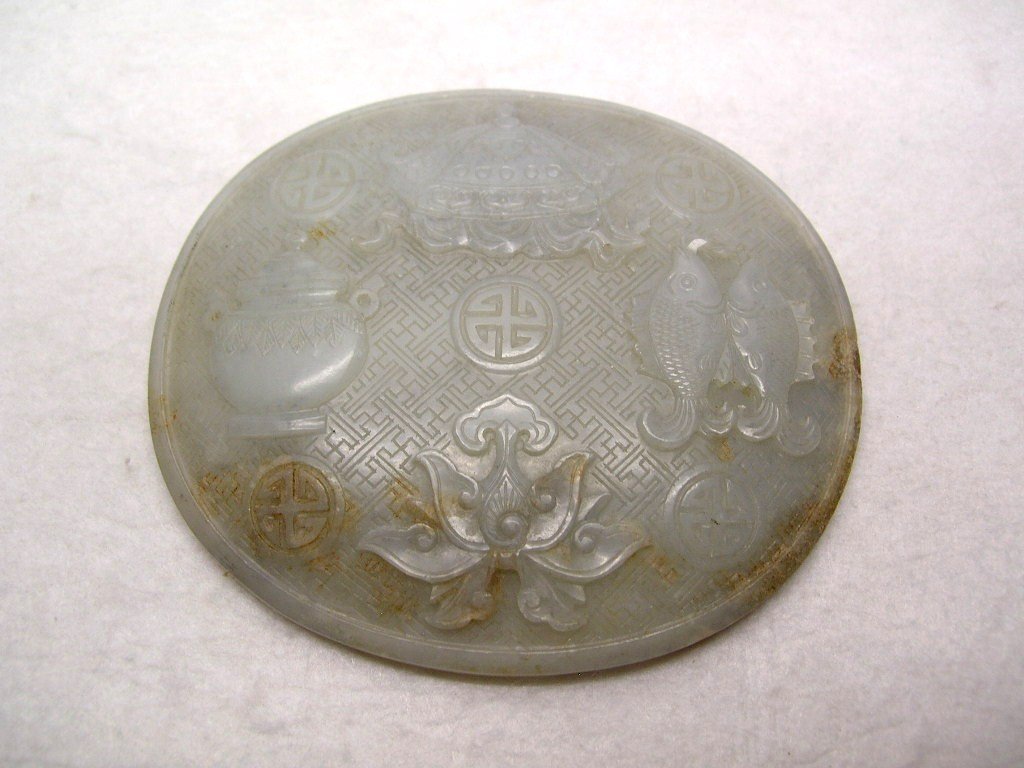 Fine Carved Pale Celadon Jade Oval Plaque Ming #la064ns: Celadon nephrite jade oval plaque, previously being inlaid with a Ruyi scepter, finely carved with four symbols of "Buddhist Eight Treasures", the jade of an even greyish tone with amber mottling, Min