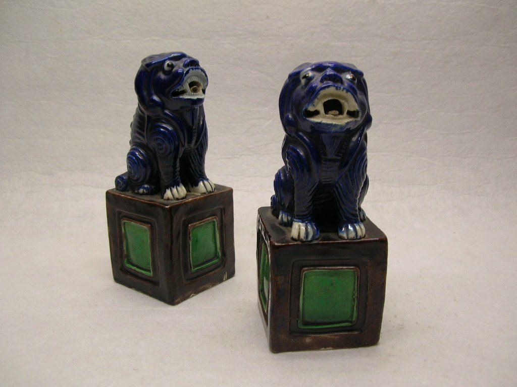 Pair of Chinese Blue Glaze Foo Dogs Qing Dy. #la268srb: A very unique pair Chinese blue glazed porcelain foo dogs / Buddhist lions, each standing on a high pedestal with vivid expression, 18th / 19th century, Qing Dynasty, good condition, 5 5/8" high