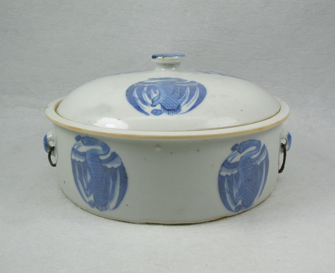 Chinese Blue and White Porcelain Tureen: Qing Dynasty, with metal handles, decorated with phoenix motifs in Kangxi style, some glaze bursts and minor repair / touchups to edges, 6 7/8" diameter