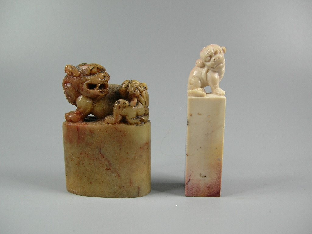 Two Antique Chinese Soapstone Shoushan Seal Stones: With finials carved in lion forms, 20th century, good condition, 2 9/16 in. (6.5 cm) and 2 1/4 in. (5.8 cm) high