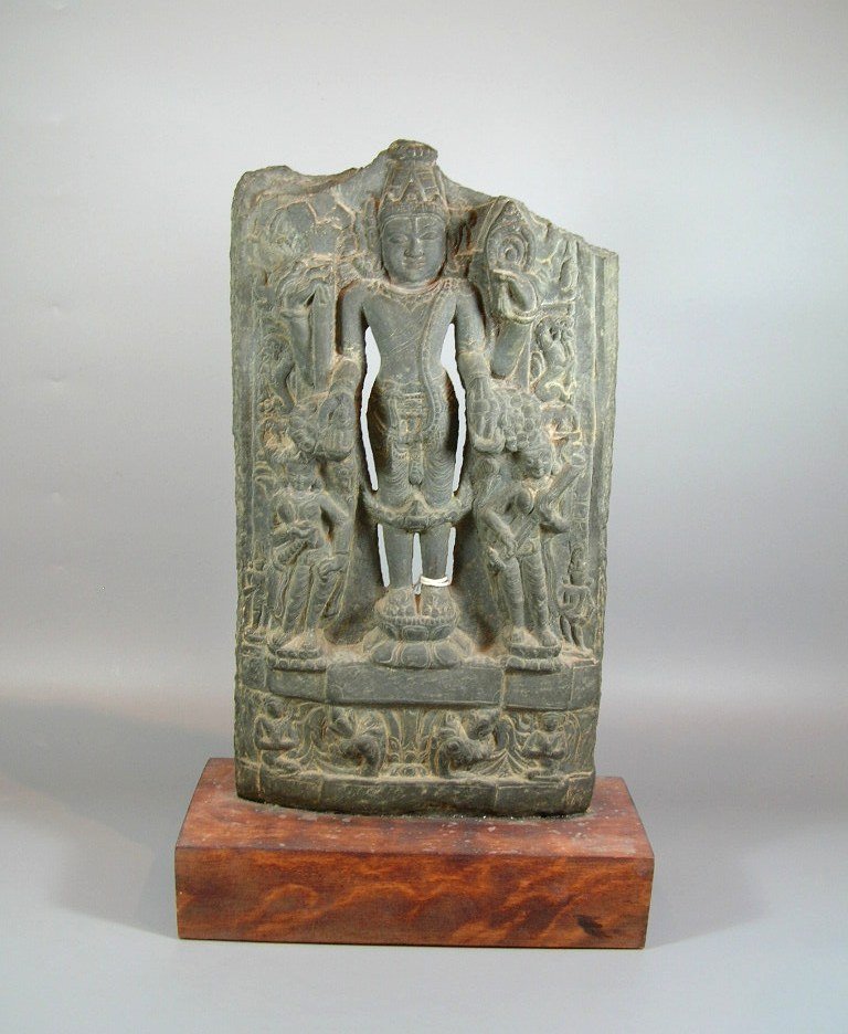 11th Century Indian Grey Limestone Buddhist Stele: 11th / 12th century, wooden stand, some losses, private New York collection, 15 1/2 in. (39.5 cm) high (stele only)