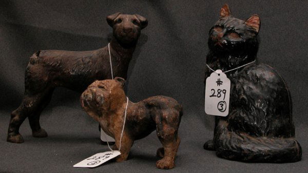 3 Iron doorstops: black cat with wear, 9"h x 6 1/2: 3 Iron doorstops: black cat with wear, 9"h x 6 1/2"L x 4"; rusty bulldog, 5 1/2"L x 4 1/2"L x 3"w; mutt with 1" hole where tail should be, 7 1/2"h x 8"L x 2"w