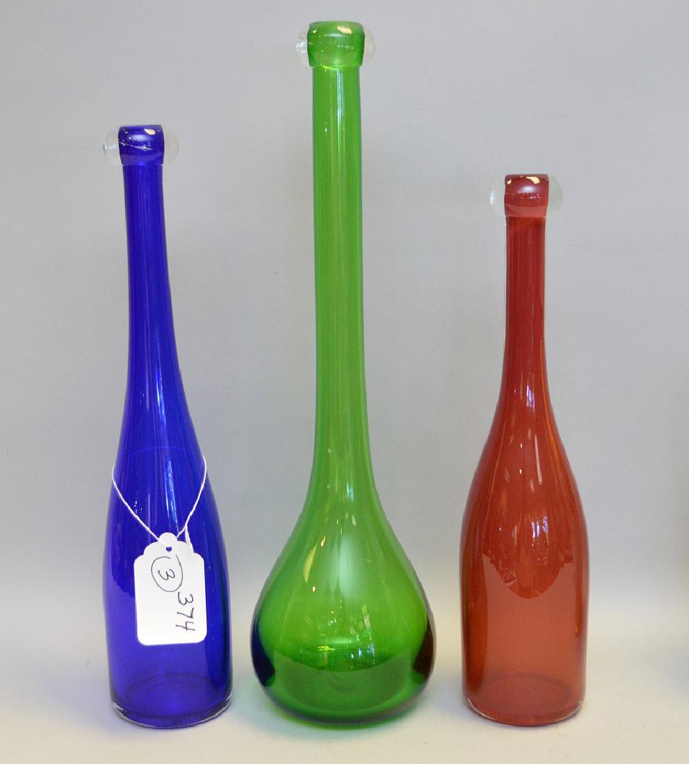 3 art glass bottles, red (15"h), blue (16"h) and green: 3 art glass bottles, red (15"h), blue (16"h) and green (18"h)