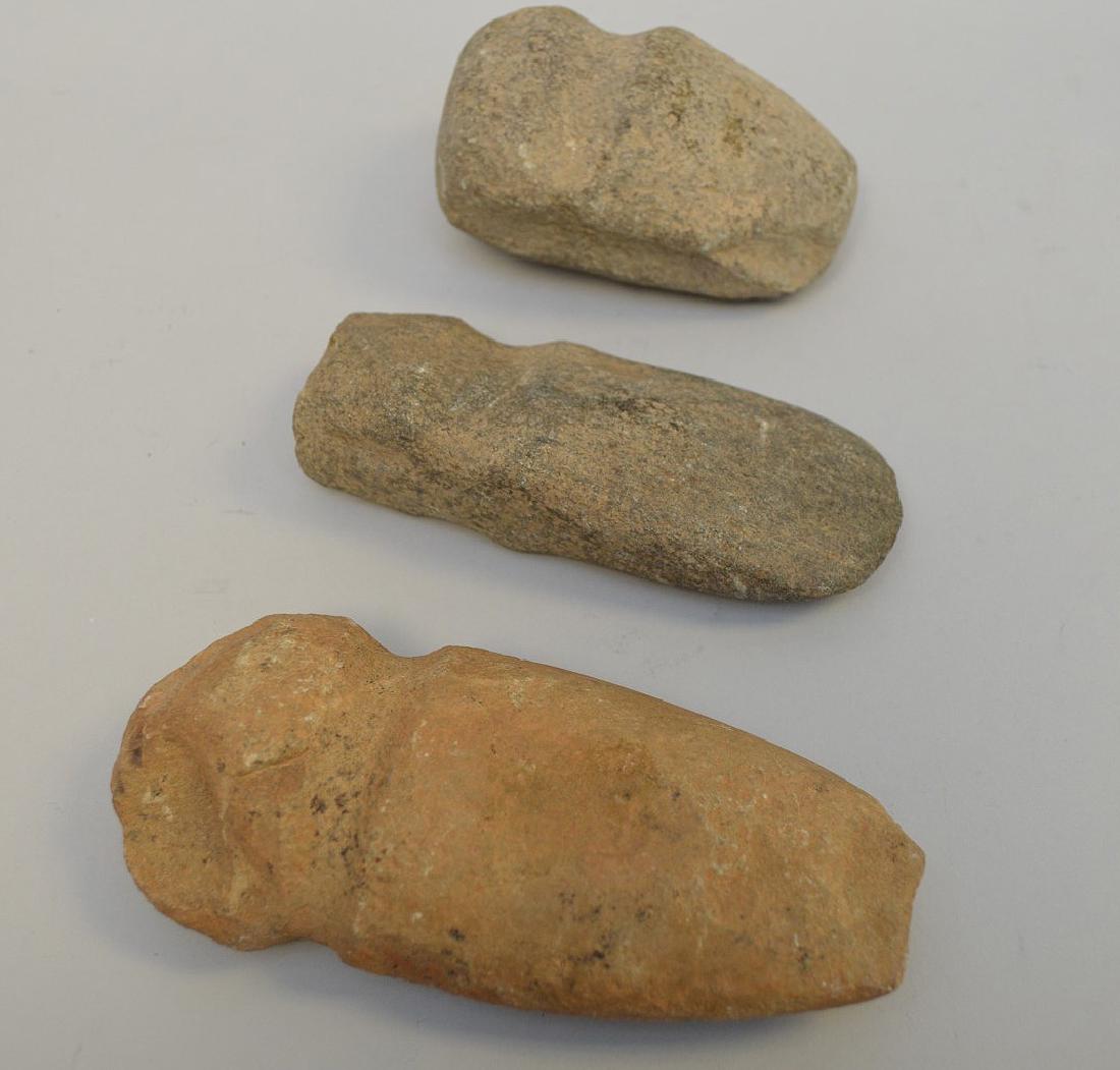 Three Pre-Columbian stone axe heads, 3 3/4" to 5 5/8".: Three Pre-Columbian stone axe heads, 3 3/4" to 5 5/8". Condition: showing normal appropriate wear for their age. This lot is from the Florida Estate of J.J. Schmidt Jr. and was acquired prior to 1970.