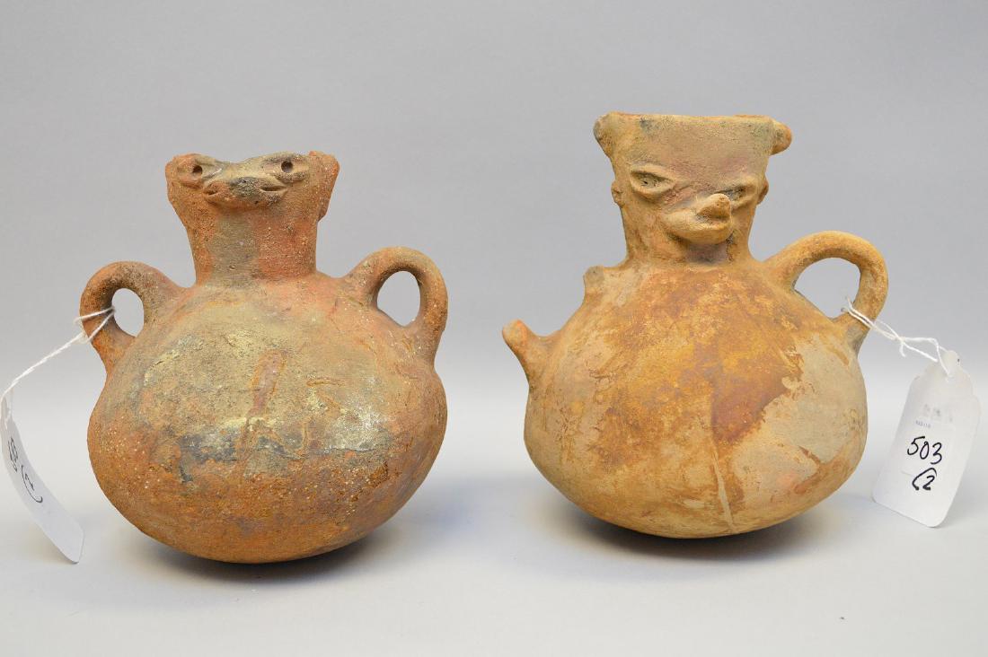 Two Pre-Columbian animal faced effigy pottery vessels,: Two Pre-Columbian animal faced effigy pottery vessels, 200 B.C. - 200 A.D., El Salvador & Pacific Coast, 6 1/4"h & 7"h. Condition: one handle is broken. Showing normal appropriate wear for their age. 