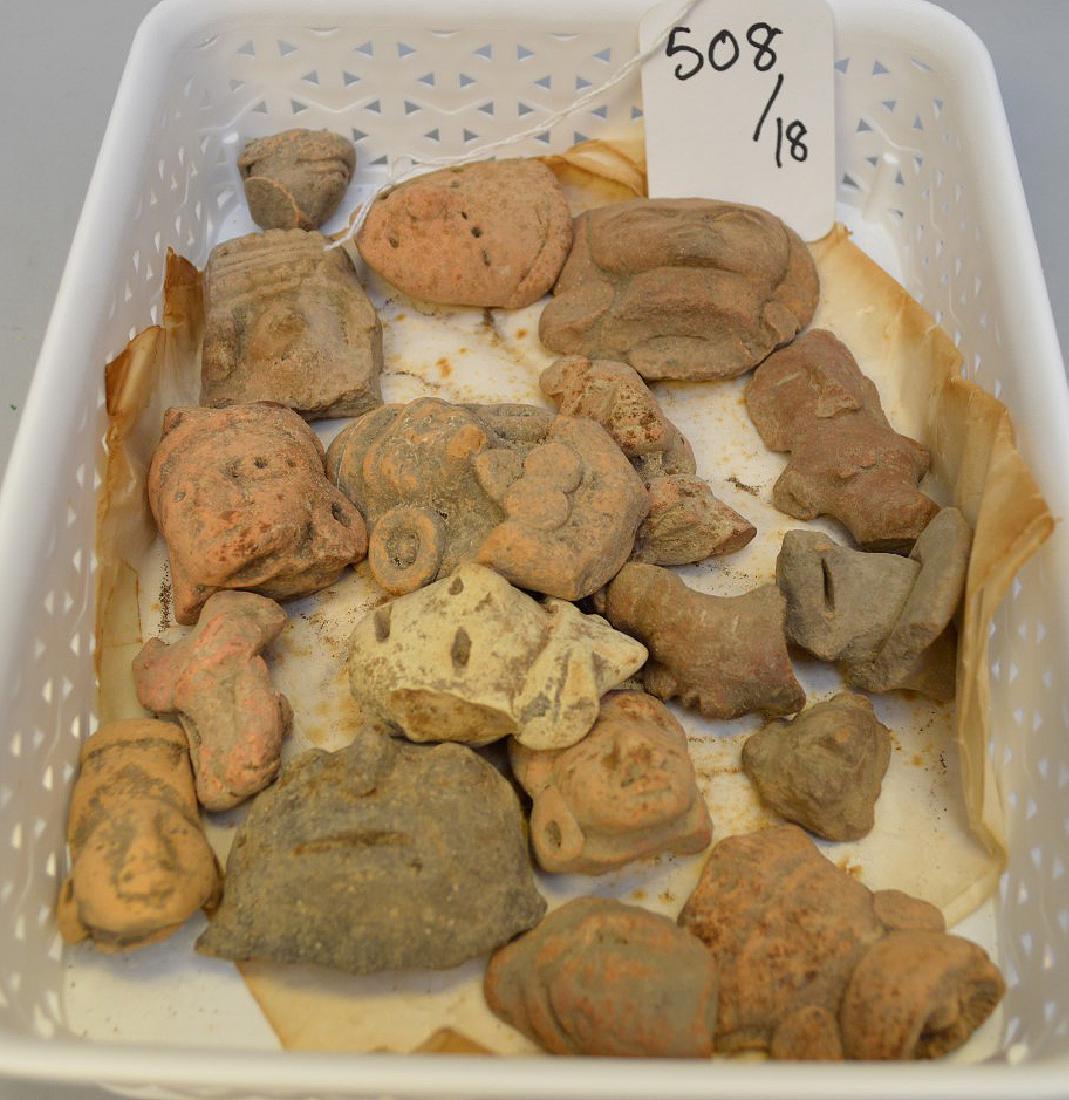 Collection of Pre-Columbian Pottery Figurine Heads.: Collection of Pre-Columbian Pottery Figurine Heads. Eighteen pieces. Appox. 2" h. Mexico and Central America. (ca ~200 BC - 800 AD) Unslipped. Condition: All are broken and were likely part of a large