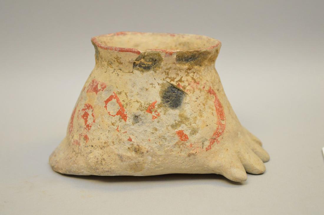Pre Columbian Polychrome Pottery Foot-Shaped Cup -: Pre Columbian Polychrome Pottery Foot-Shaped Cup - Central America. Small unusual stylized human foot cup. Remnants of red painted swirl design on orange/buff background. 2 3/8" h x 2 3/4" w x 4 3/8" 