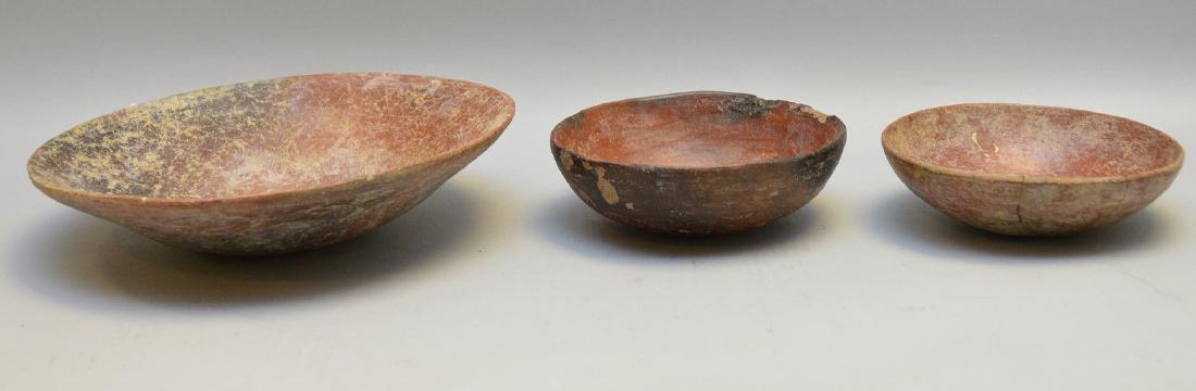 Three Pre-Columbian Red Slip Shallow Pottery Bowls -: Three Pre-Columbian Red Slip Shallow Pottery Bowls - Central America. Red Slip and some oxidation. One smaller bowl has exterior brown slip. Larger bowl is 8 1/4" dia. Smaller bowls are 5" dia. Condit