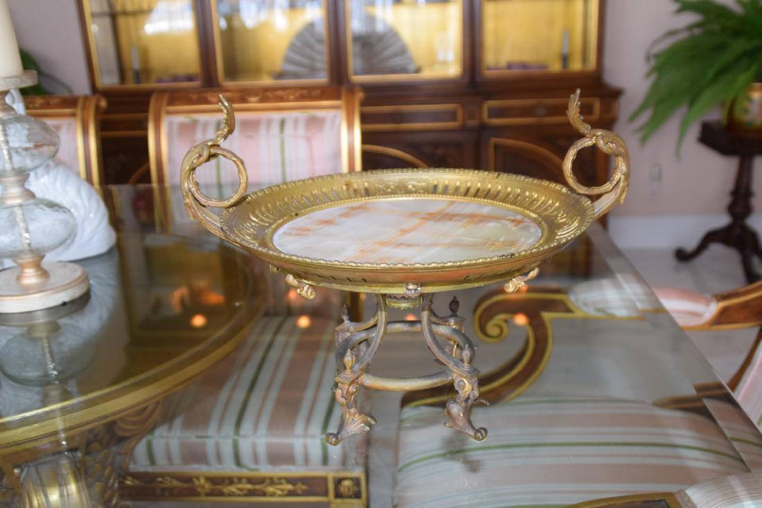 19th Century Gilt Bronze & Onyx Tazza with Reticulated: 19th Century Gilt Bronze & Onyx Tazza with Reticulated Rim. Condition: Good with no noticeable damage and very minor normal wear. Dimensions: 10” H x 13 1/2” diameter.