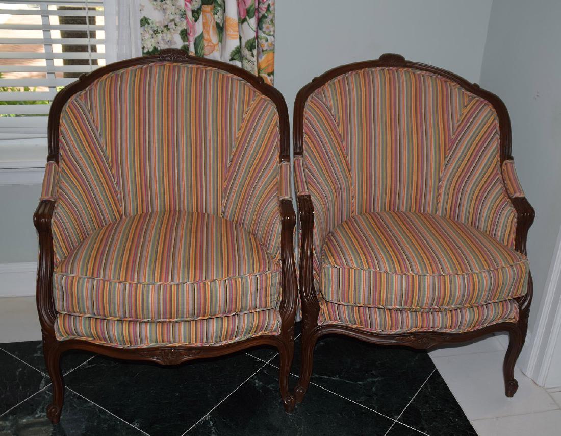 Pair French style Bergeres with carved flowerette at: Pair French style Bergeres with carved flowerette at crest, stripe upholstery