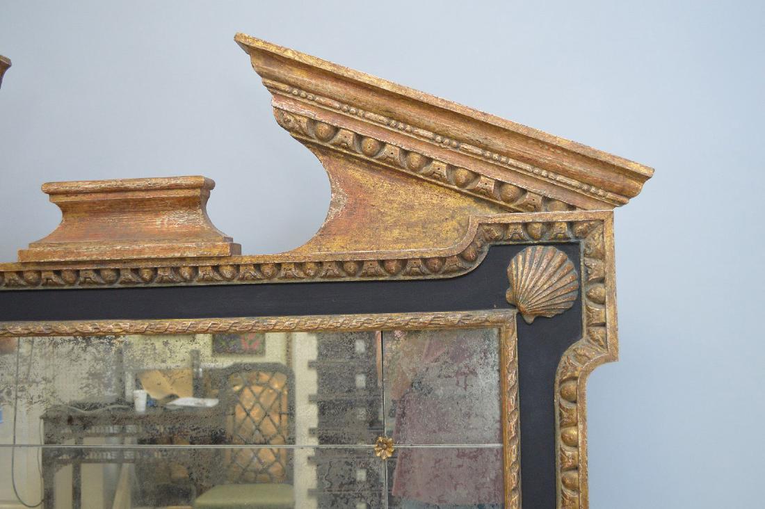 Oversized mirror, arch pediment at top over smoke (1 of 3)