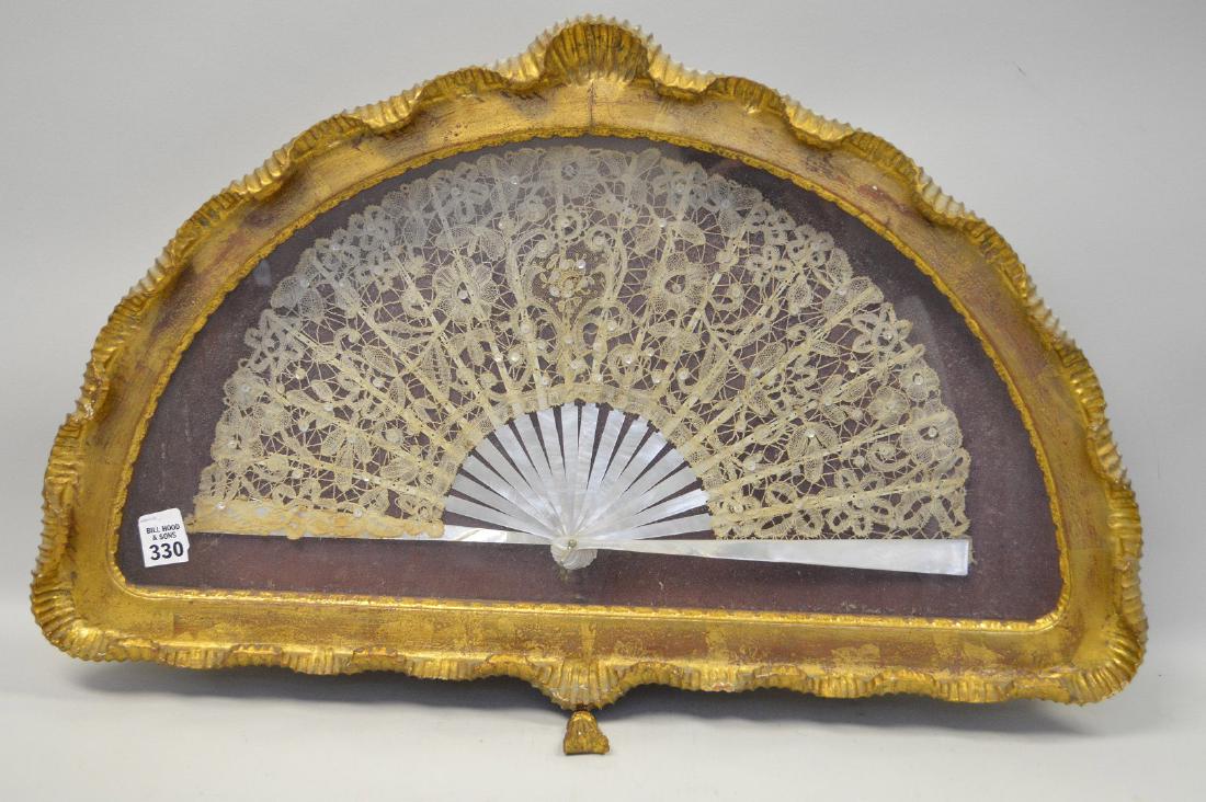 Giltwood shadow boxed frame with mounted lace and: Giltwood shadow boxed frame with mounted lace and mother of pearl fan, 16"h x 25"w