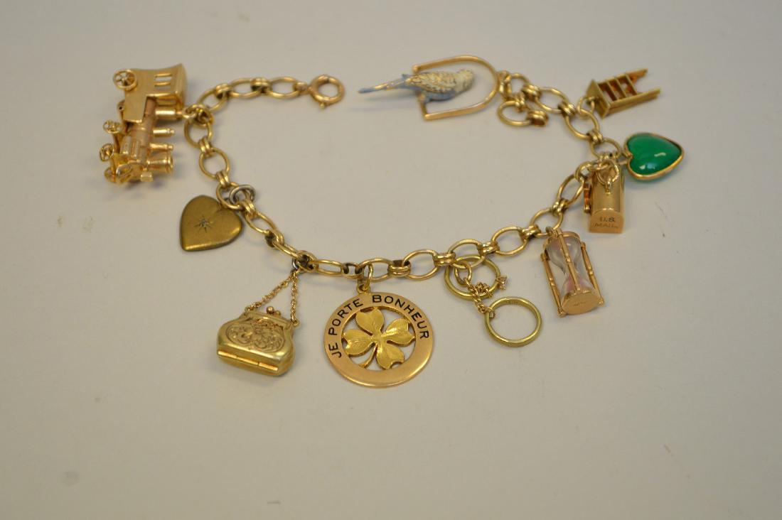 14K YELLOW GOLD CHARM BRACELET, Wt 29.3 grams, in good (1 of 5)