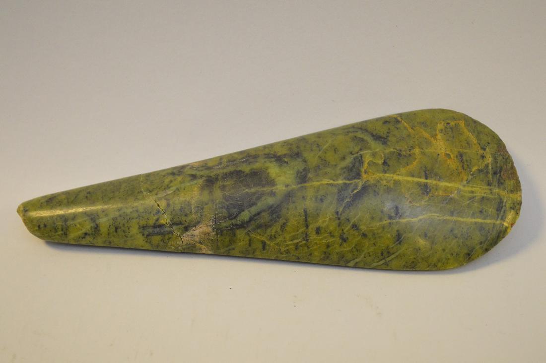 FOUR PRE-COLUMBIAN JADE ARTICLES - Includes a green: FOUR PRE-COLUMBIAN JADE ARTICLES - Includes a green jade axe head 8 3/4” L (has repaid on one end, wear & tool marks consistent with use); an Olmec green jade mask pendant 1 1/8” L; and two jade p